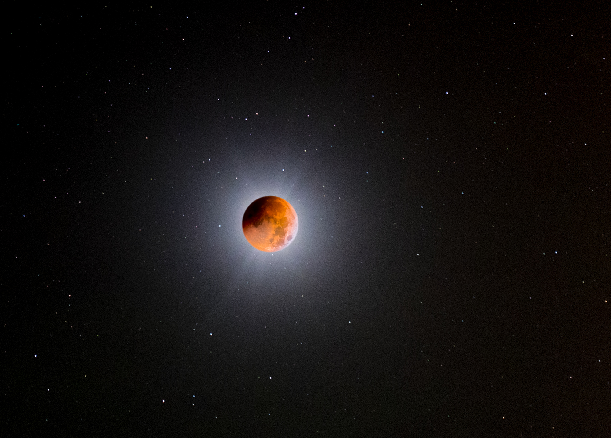 Eclipsed moon with lots of stars in the sky